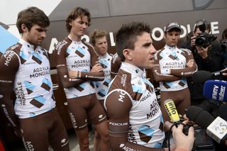 France's Samuel Dumoulin reads a statement to journalists, flanked by teammates of the France's AG2R La Mondiale cycling team.