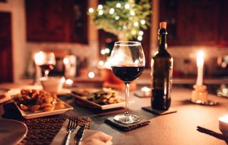 A wine glass at a dinner table