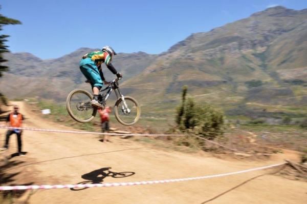 A racer gets some air at the African Continental Downhill Championships