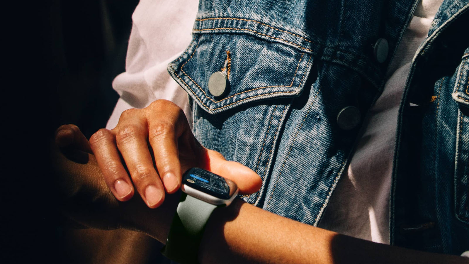A woman wears an Apple Watch