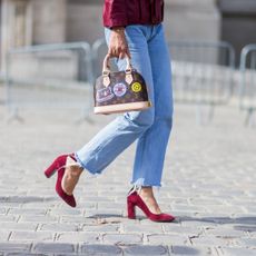 Woman in Jeans with red shoes