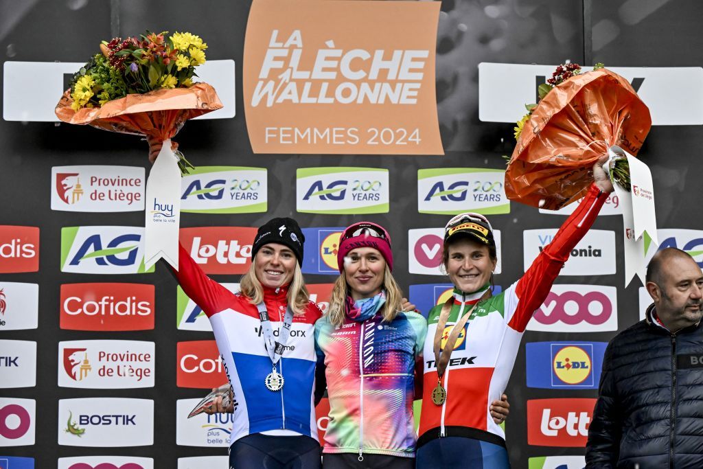 Dutch Demi Vollering of SD Worx - Protime, Polish Katarzyna Niewiadoma of Canyon-SRAM and Italian Elisa Longo Borghini of Lidl-Trek pictured on the podium after the women's race of the 'La Fleche Wallonne', one day cycling race (Waalse Pijl - Walloon Arrow), 146 km with start and finish in Huy, Wednesday 17 April 2024. BELGA PHOTO ERIC LALMAND (Photo by ERIC LALMAND / BELGA MAG / Belga via AFP)