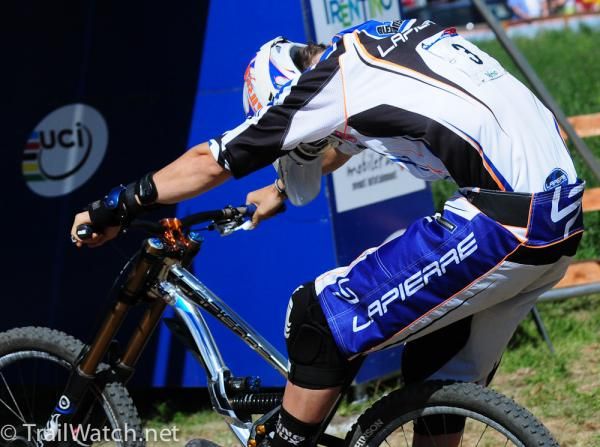 Sam Blenkinsop (Lapierre International) throwing his bike over the line