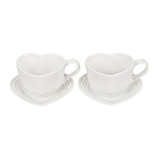 Le Creuset heart shaped mugs and saucers in white