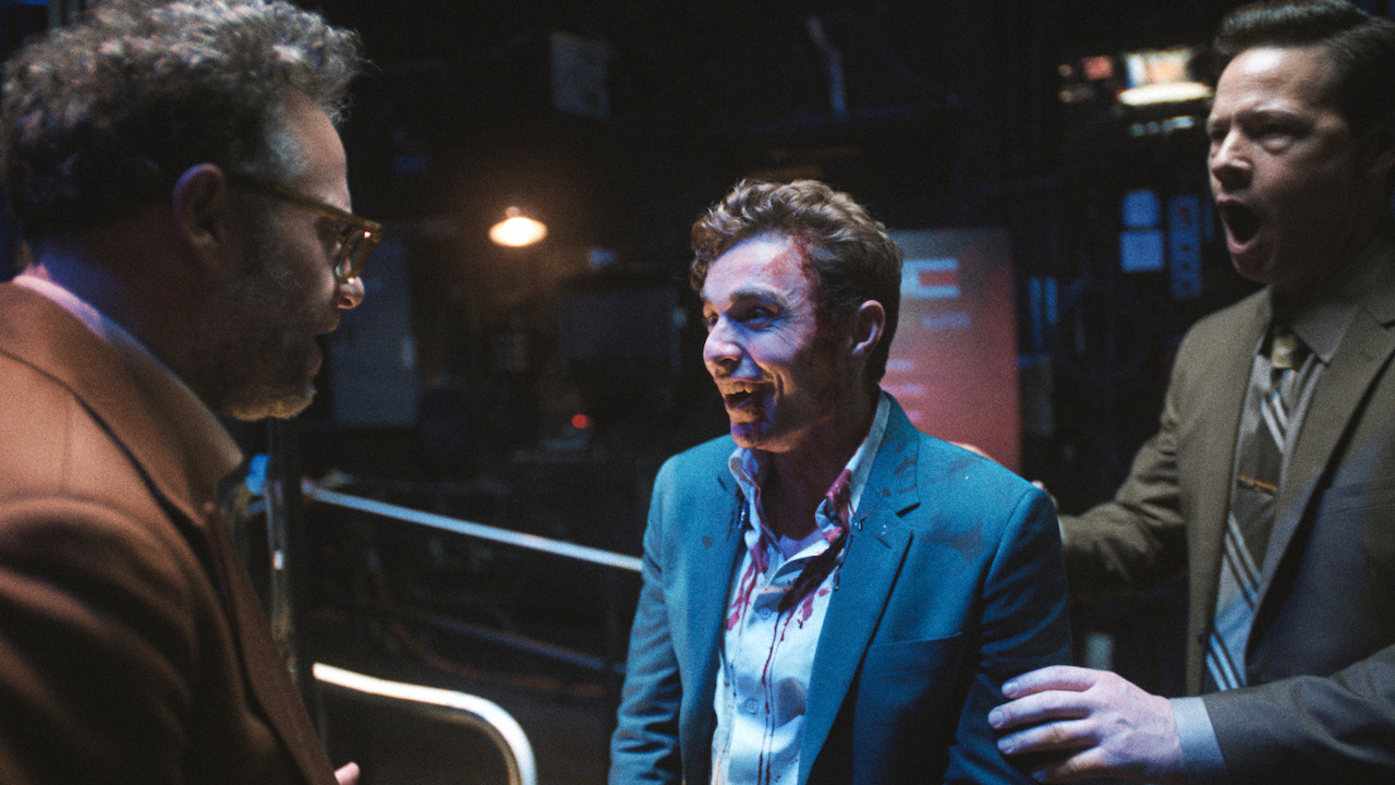 Dave Franco laughing with blood on his face and clothes in The Studio Season 1 finale