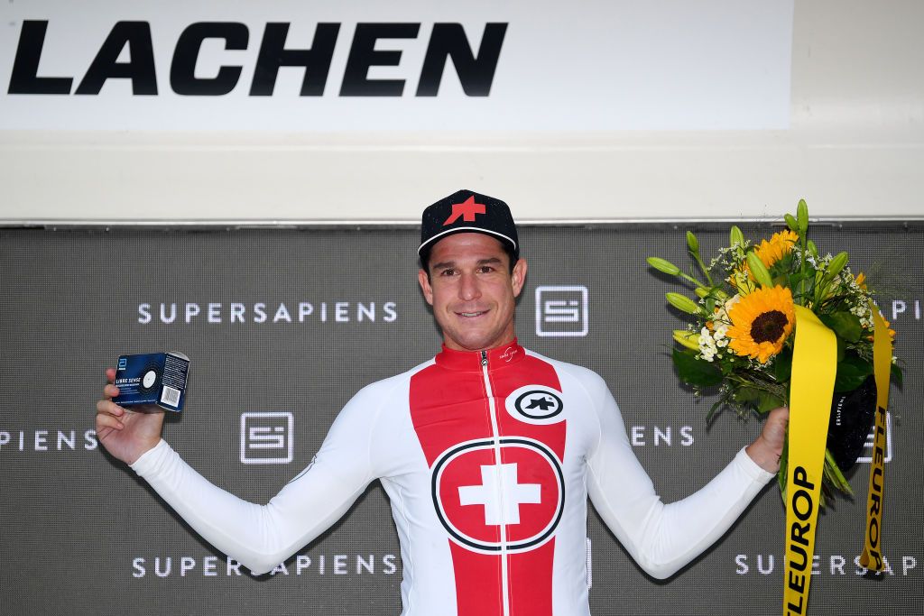 LACHEN SWITZERLAND JUNE 07 Claudio Imhof of Switzerland and Team Switzerland Most Combative Rider celebrates at podium during the 84th Tour de Suisse 2021 Stage 2 a 178km stage from Neuhausen am Rheinfall to Lachen UCIworldtour tds tourdesuisse on June 07 2021 in Lachen Switzerland Photo by Tim de WaeleGetty Images