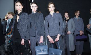 Female models wearing black and grey clothes from the Giorgio Armani A/W 2015 collection