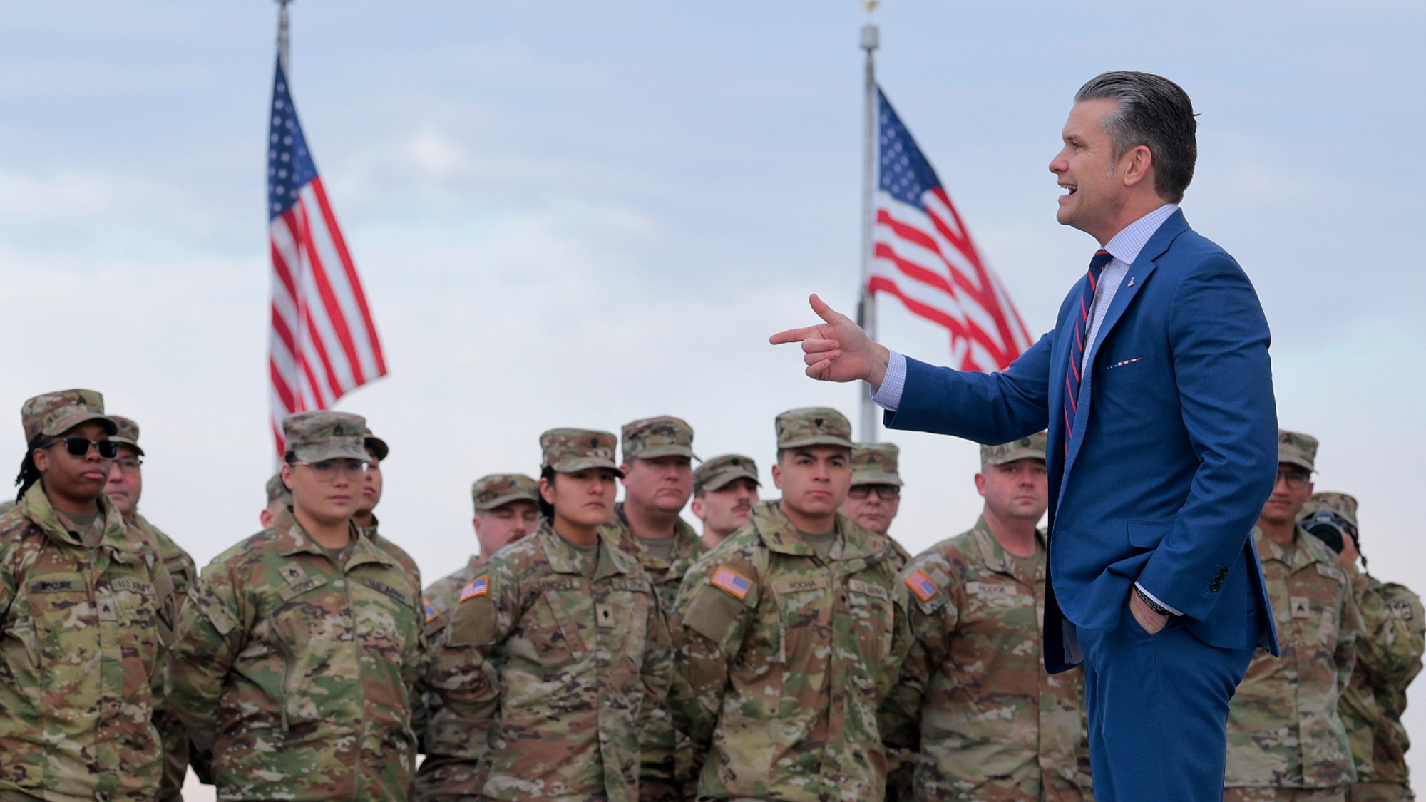 WASHINGTON, DC - FEBRUARY 06: U.S. Secretary of War Pete Hegseth address a group of National Guard troops before administering their re-enlistment ceremony at the base of the Washington Monument on February 06, 2026 in Washington, DC. Braving sub-freezing temperatures, Hegseth led a re-enlistment ceremony for 105 National Guard troops from Alabama, Arkansas, Florida, Indiana, Mississippi, Ohio, Oklahoma, South Carolina and West Virginia on the National Mall. (Photo by Chip Somodevilla/Getty Images)