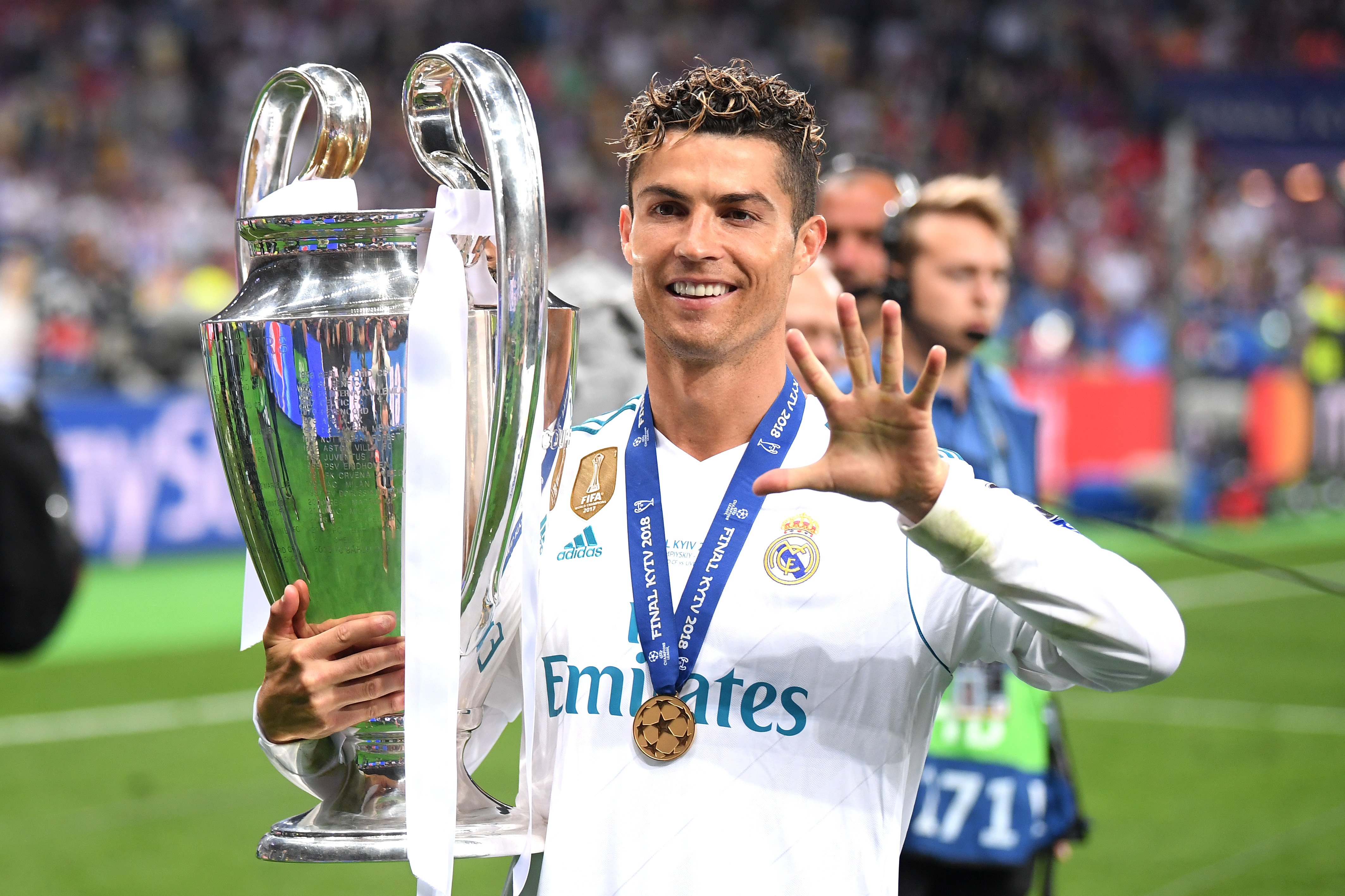 Real Madrid forward Cristiano Ronaldo poses with the Champions League trophy in 2018 after winning the competition for a fifth time.