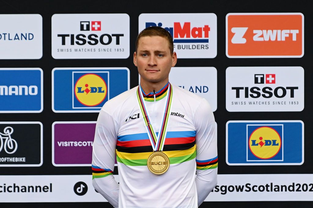 GLASGOW SCOTLAND AUGUST 06 EDITORS NOTE Alternate crop Gold medalist Mathieu Van Der Poel of The Netherlands celebrates winning during the medal ceremony after the 96th UCI Cycling World Championships Glasgow 2023 Men Elite Road Race a 2711km one day race from Edinburgh to Glasgow UCIWT on August 06 2023 in Glasgow Scotland Photo by Dario BelingheriGetty Images