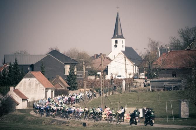 A typical Belgian scene as the race heads into another town.