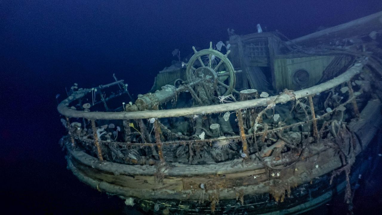 The taffrail and ship&rsquo;s wheel.
