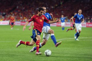 Cesc Fabregas on the ball for Spain against Italy in the final of Euro 2012.