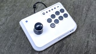 Hori Fight Stick Mini placed on pavement