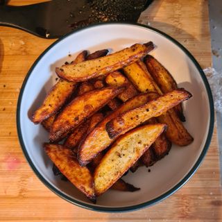 the air fried fries in a bowl after the Air fryer vs deep fryer test