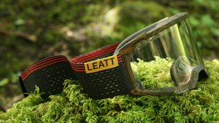 Leatt Velocity 4.0 MTB X-Flow Goggles sitting on mossy rock