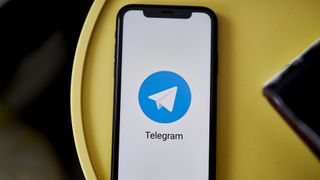Telegram logo appearing on a smartphone
