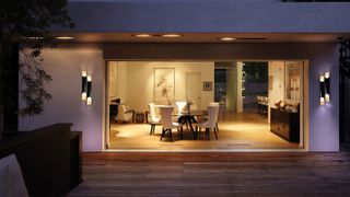 decking terrace with outdoor wall lightings and overhang