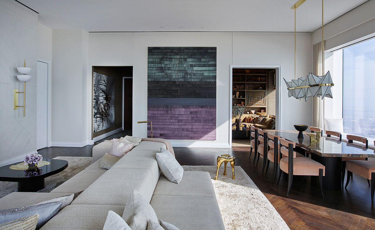 Interior with grey sofa, table, chairs