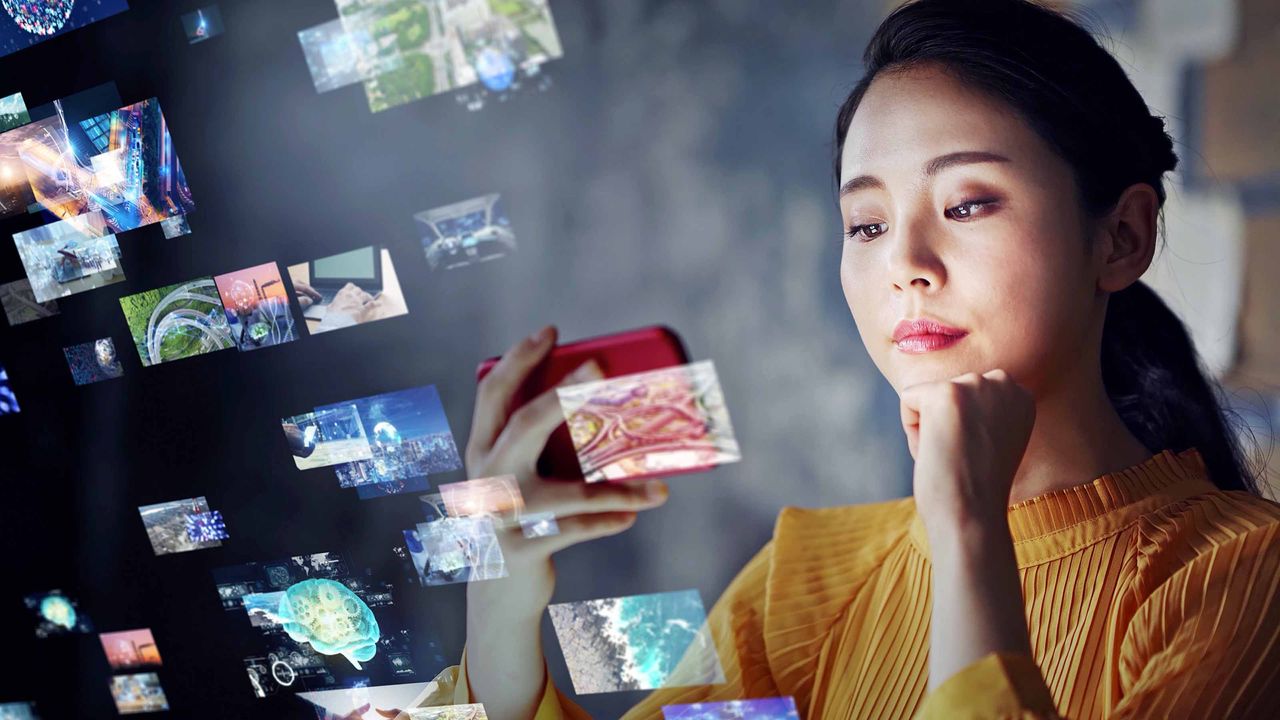 woman looking at smartphone