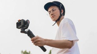 Man on horse using Hohem iSteady Pro 4 gimbal