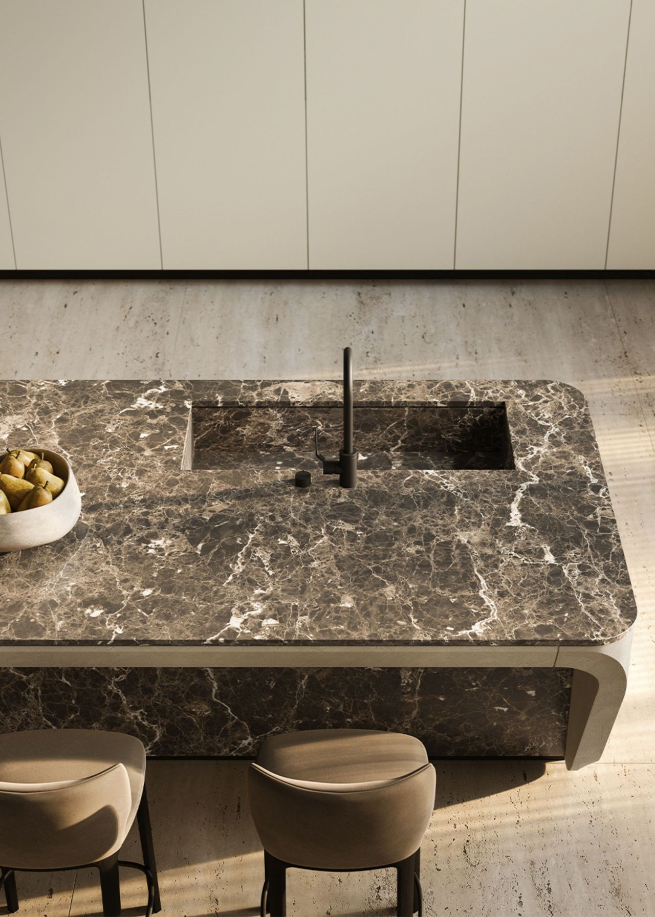 A kitchen island with bar stools beside it.