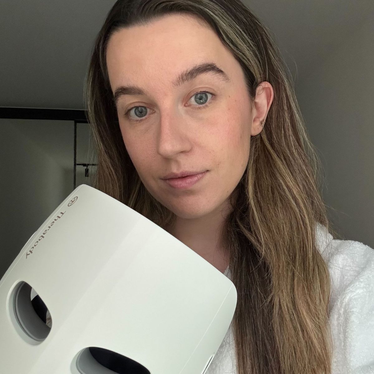 Deputy beauty editor Grace Lindsay testing the Therabody TheraFace Mask Glo