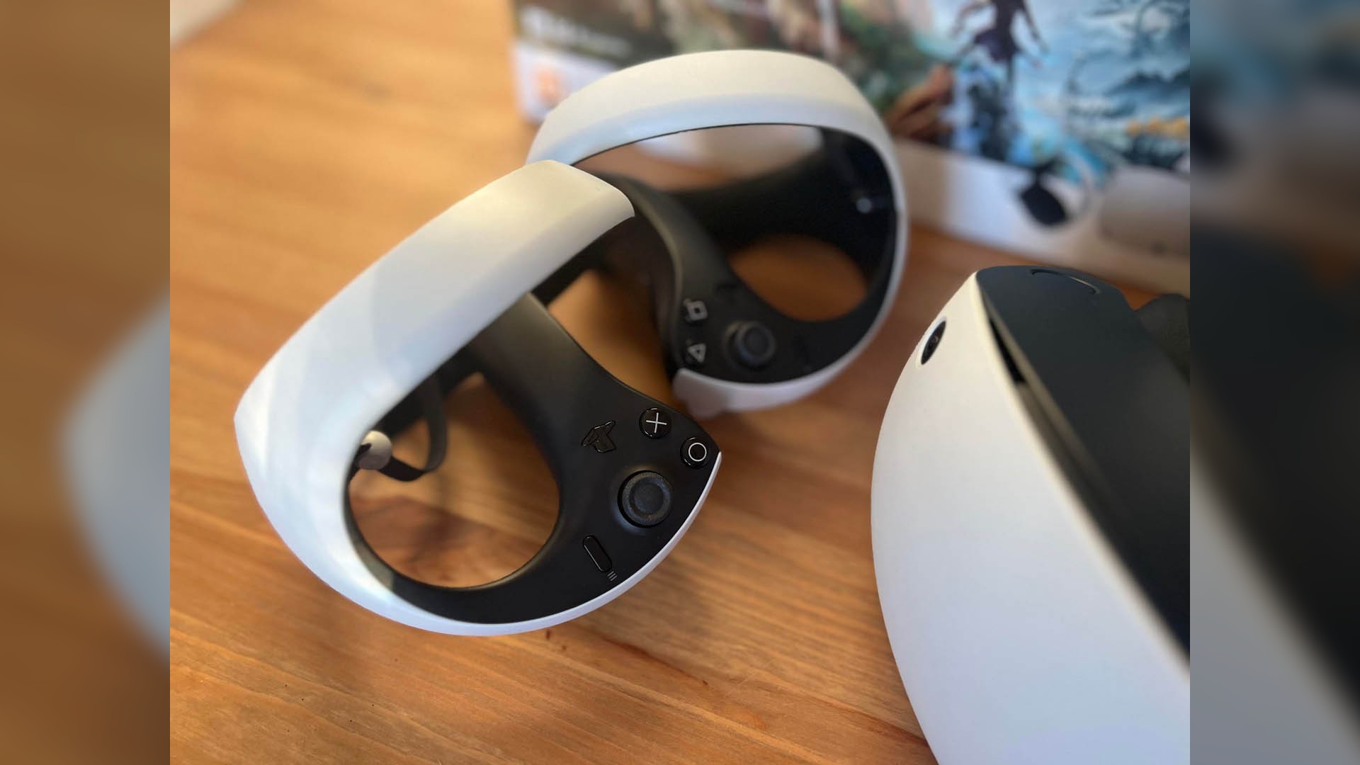 PSVR2- Close up of VR headset and controllers.