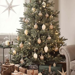christmas tree with baubles and gift boxes