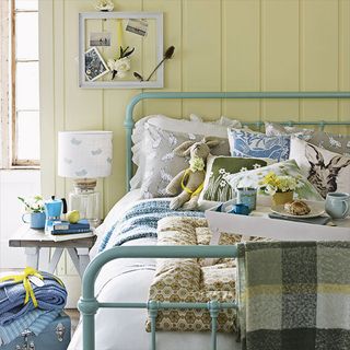 bedroom with eiderdown and duck egg bedstead