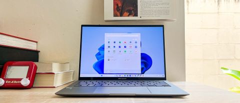 Asus Zenbook S 13 OLED review unit on desk, running Windows 11