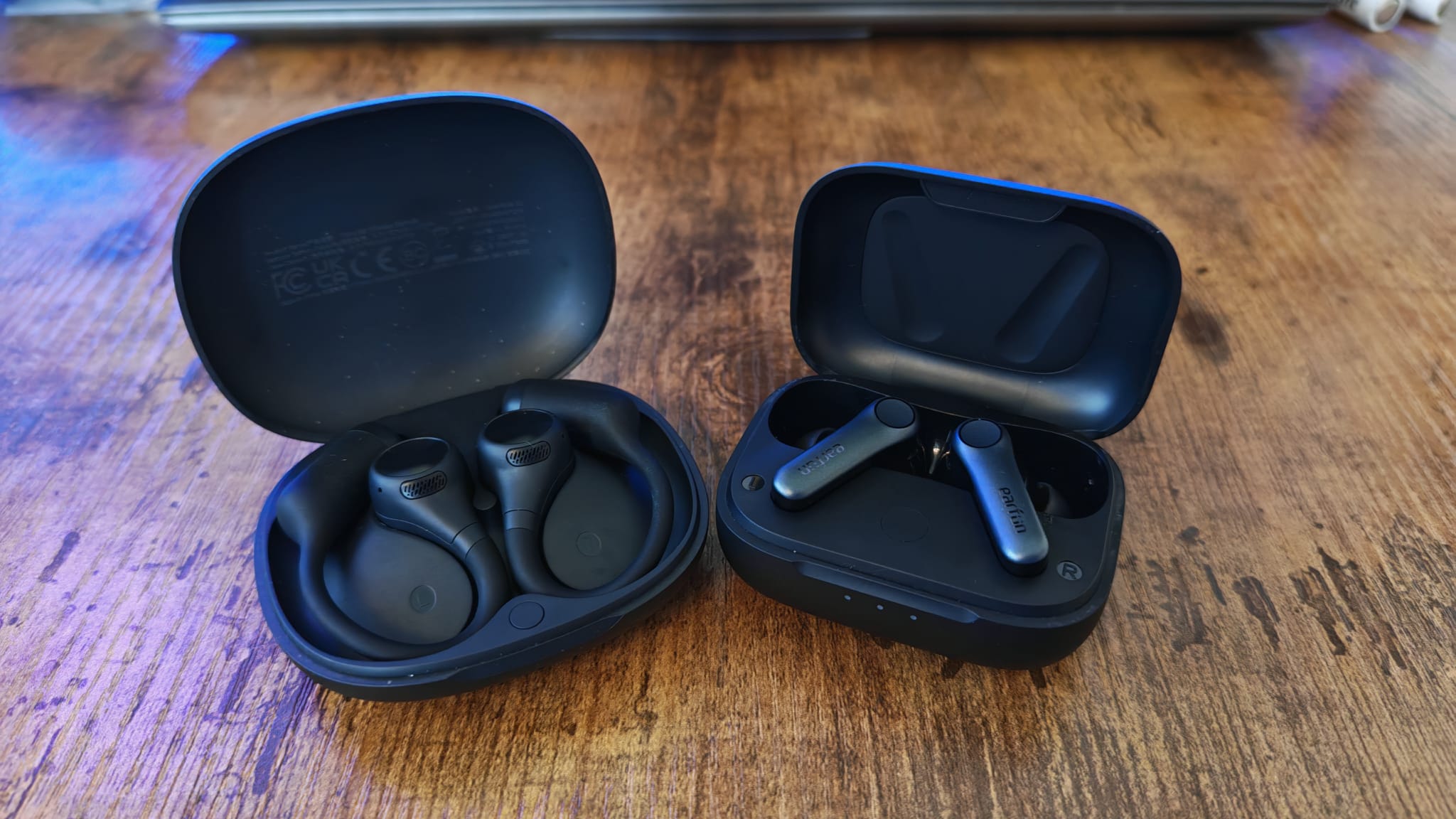 The OpenRock S2 and EarFun Air Pro 4 cases open next to one another