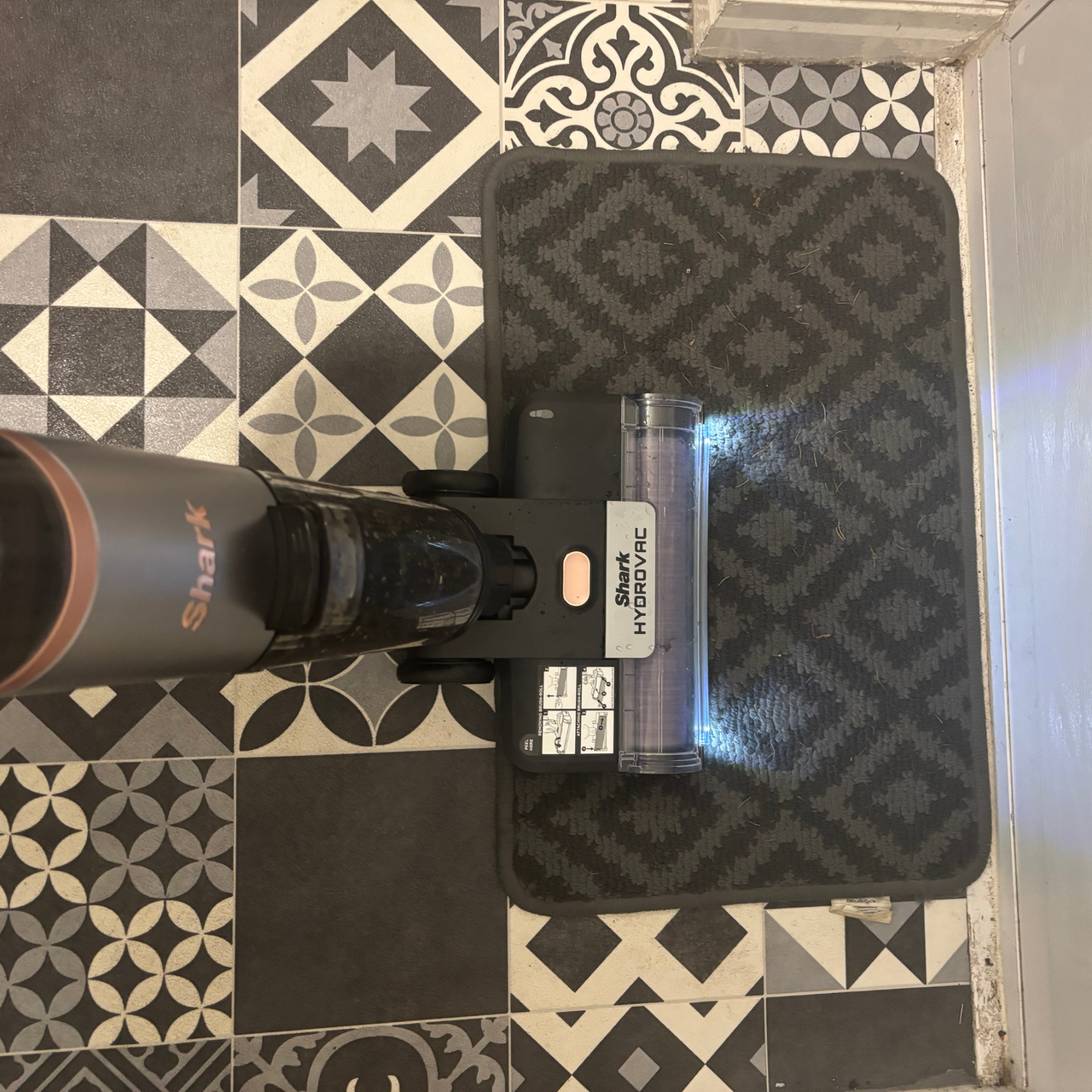 Shark HydroVac Cordless Hard Floor Cleaner in use on door mat
