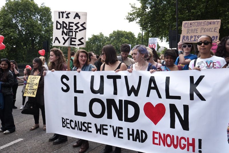 SlutWalk London march with a banner.