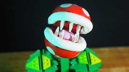 Lego Piranha Plant with a tilted head on a wooden table