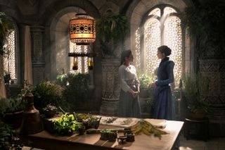 wheel of time episode 6: moiraine and egwene talking in a sunlit room