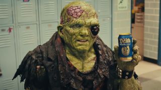 The Toxic Avenger holding a Liquid Death soda