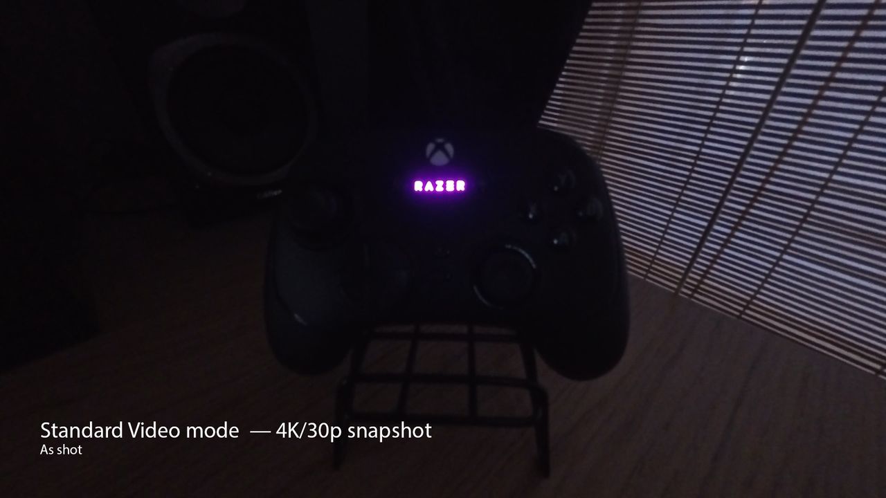A photo of a Razer controller taken on the Insta360 Ace Pro 2 in low light