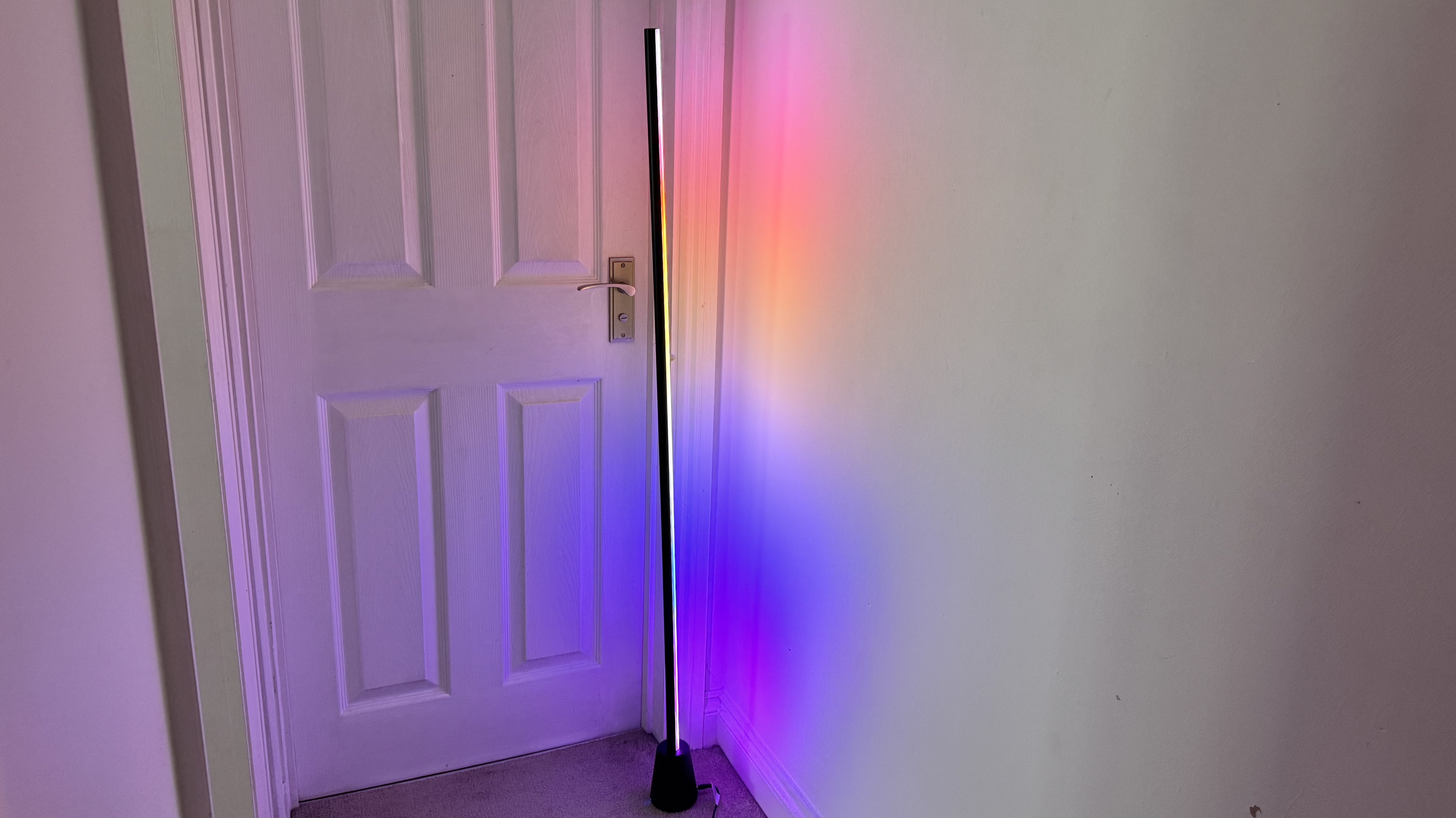 WiZ Gradient Floor Lamp illuminated in rainbow colors