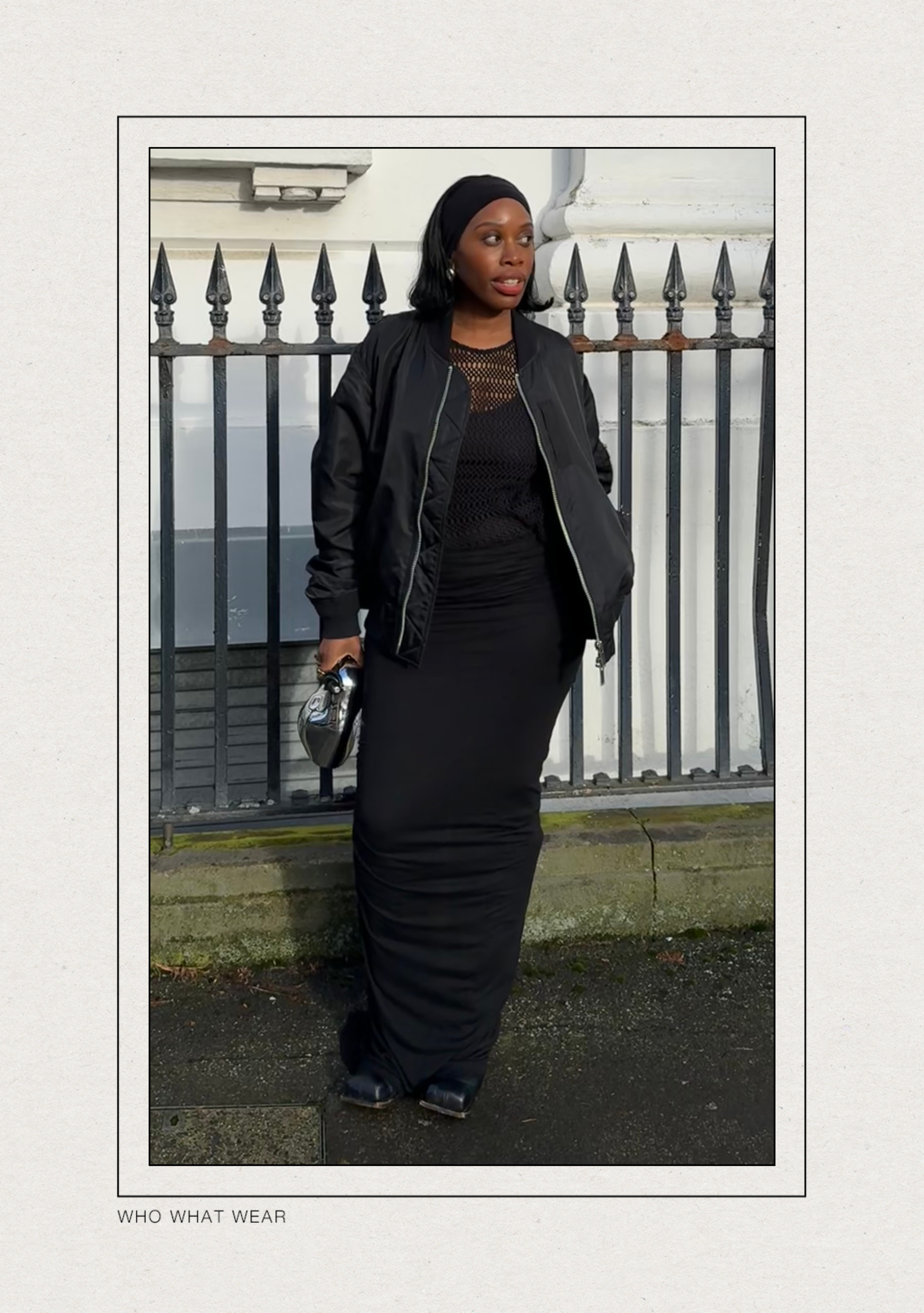 @anuogugbesan wears a black bomber jacket with a sheer long-sleeve top, a black Rick Owens maxi skirt and long square-toed boots whilst standing in the street