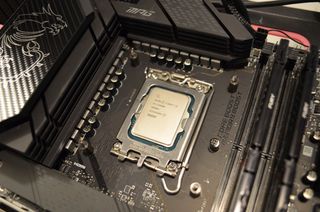Intel Core i9-13900K processor in a motherboard socket.