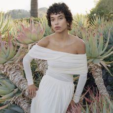 Model wearing white off the shoulder H&M dress