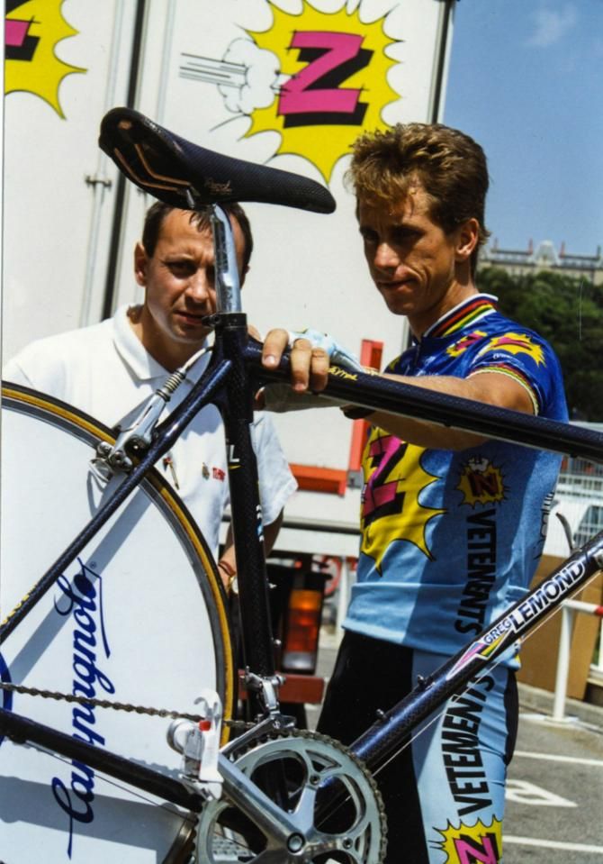 Greg LeMond assists with the prep of a time trial bike