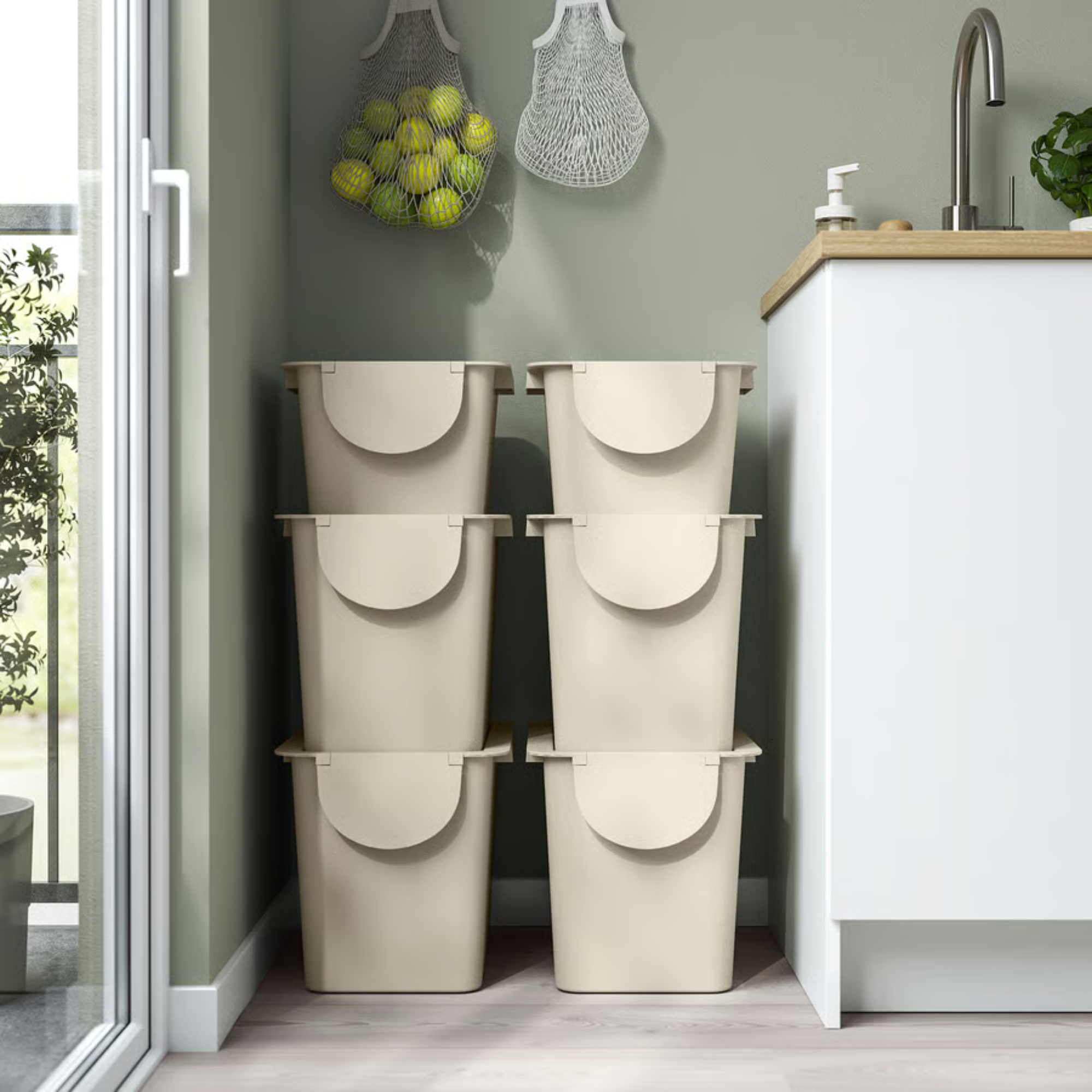 6 IKEA TR&Ouml;SKNING Bins stacked on top of each other in a kitchen.