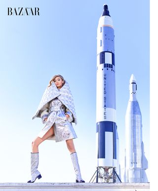 Gigi Hadid poses with a rocket display at NASA's Kennedy Space Center in Florida in this image from a Harper's Bazaar photo shoot.