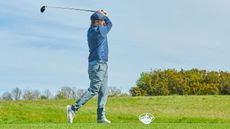 nick bonfield teeing off at london golf club with a white tee marker visible 