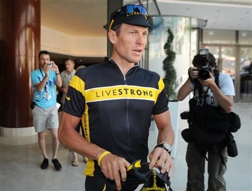 Lance Armstrong in front of his team hotel prior to a training ride.