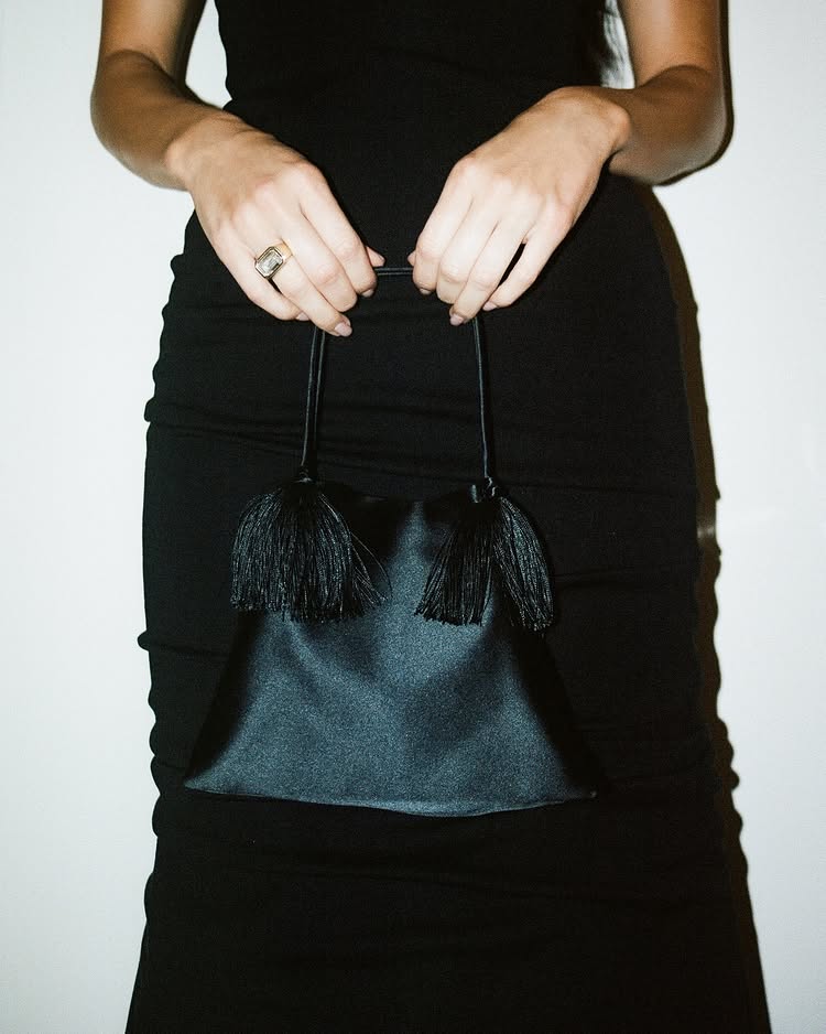 An image of Kendall Jenner with an east-west Emerald cut bezel-set ring.