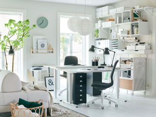 A home office with shared desk and modular wall storage