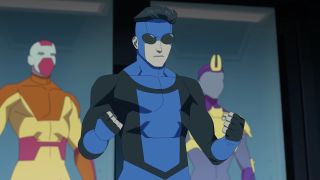 Mark Grayson wearing his new blue and black Invincible costume